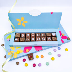 A box of solid milk chocolate blocks, which spell out the message Bride and Groom. This can be personalised for any happy couple.