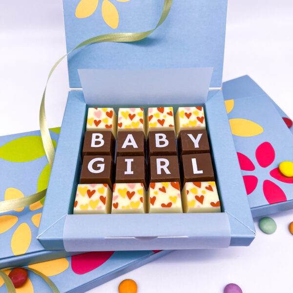 A box of solid milk and white chocolate blocks that spell out the words Baby Girl. Can be personalised for a girl or boy.