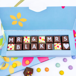 A box of solid milk and white chocolate with the message Mr and Mrs Blake spelled out in chocolate. This can be personalised for any happy couple.