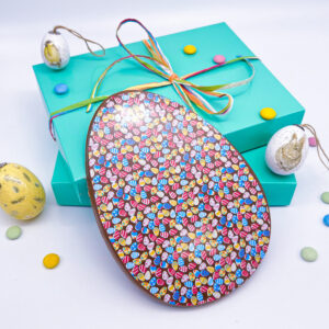 A Handmade Milk Chocolate Easter Egg with Easter Egg Decorations