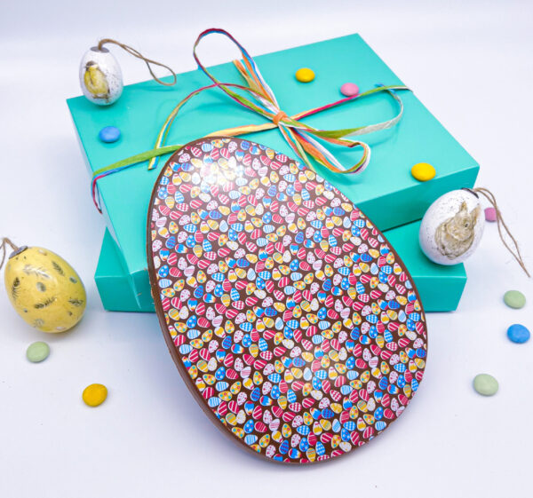A Handmade Milk Chocolate Easter Egg with Easter Egg Decorations