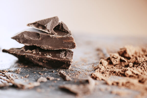 Chocolate chunks on stone background.